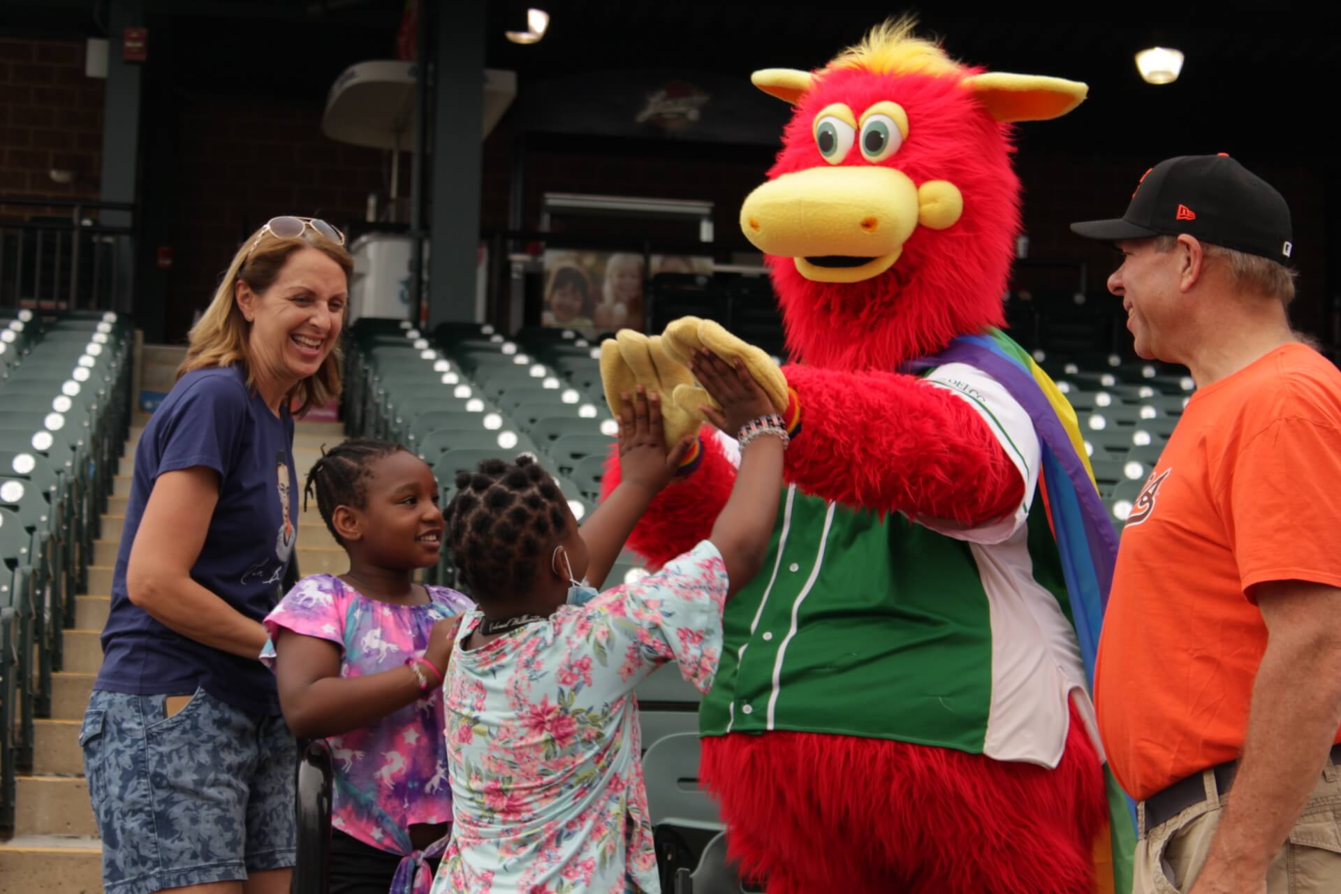 Cylo, the mascot, greeting a family at a Lancaster Barnstormers game.