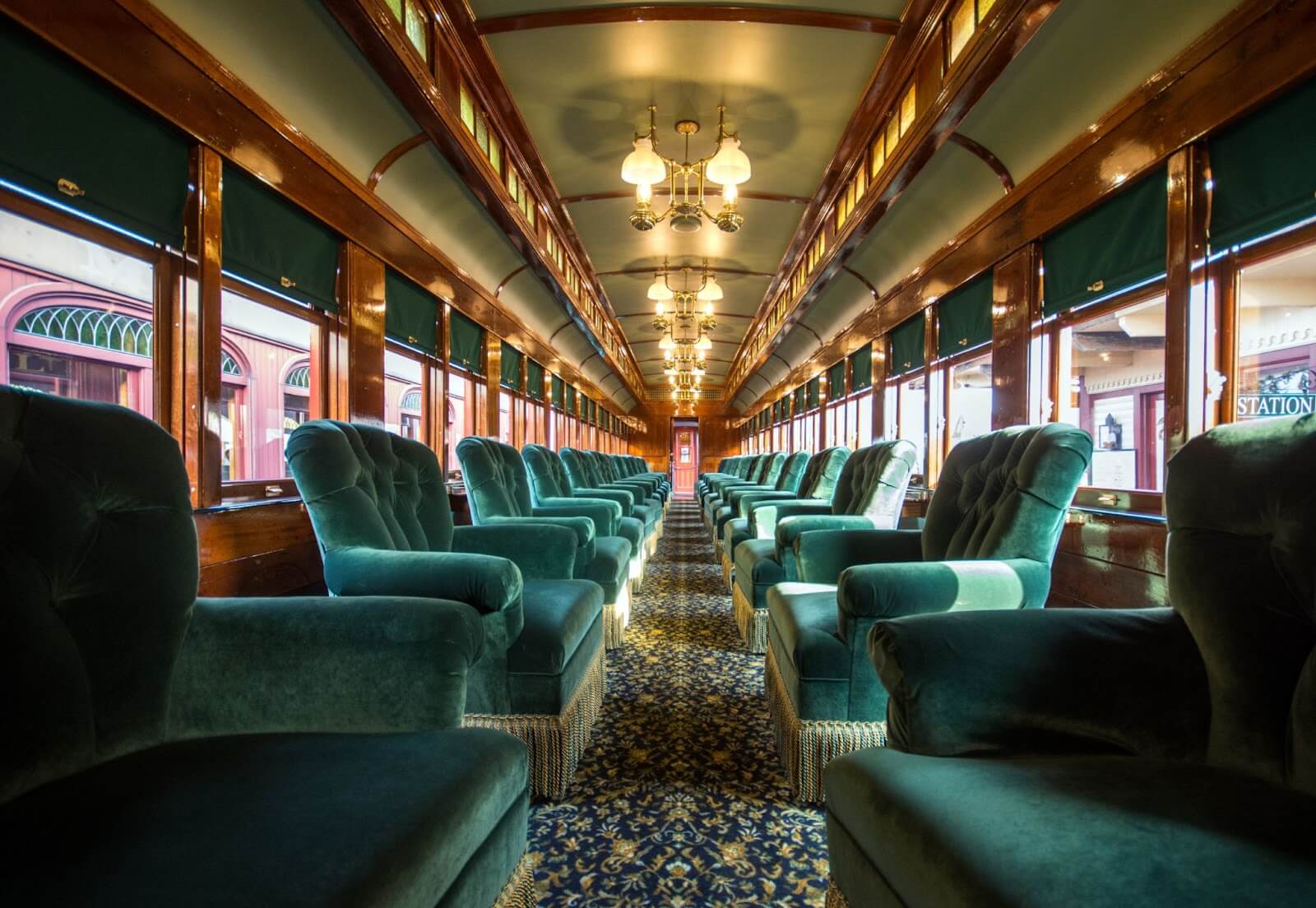 Upholstered chairs on a passenger train.