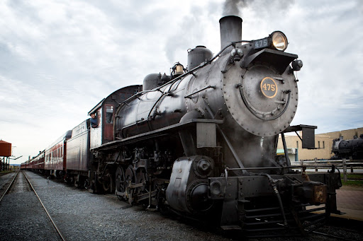 A stationary steam engine on a train track at the Strasburg Rail Road.