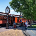Guests standing beside the train car at Strasburg Rail Road.